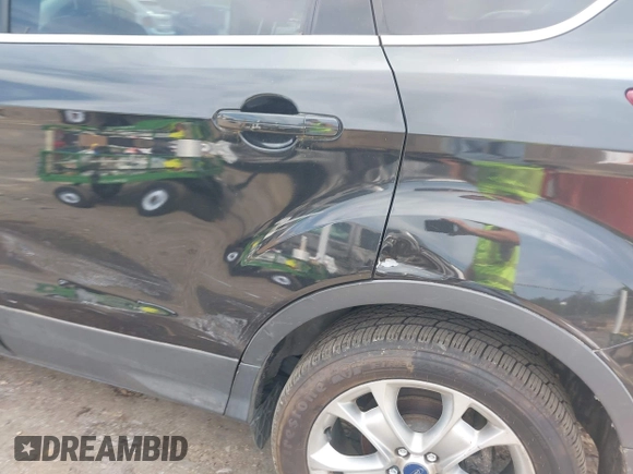2014 Ford Escape Titanium with VIN 1FMCU0JX1EUD71953, listed as a IAAI auction lot 42036023 with 165,624 mi miles. Bid and sale history available at carsss.com. Image 12.