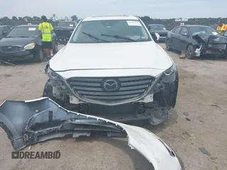 2021 Mazda CX-9 Touring with VIN JM3TCACY9M0526376, listed as a IAAI auction lot 42264478 with 74,671 mi miles and . Bid and sale history available at DreamBid. Image 6.