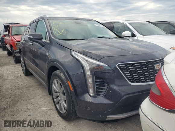 2022 Cadillac XT4 FWD Premium Luxury z VIN 1GYFZCR44NF166169, wystawiony jako Copart lot #77981414 z przebiegiem 9 734 mil mil oraz Nie do naprawy • Non repairable. Historia ofert i sprzedaży dostępna na DreamBid. Obrazek 4.