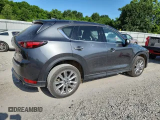 2020 Mazda CX-5 Grand Touring z VIN JM3KFADM2L0803589, wystawiony jako Copart lot #61916825 z przebiegiem 63 663 mil mil oraz Szkoda całkowita • Salvage title. Historia ofert i sprzedaży dostępna na DreamBid. Obrazek 3.
