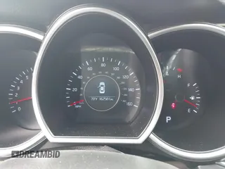 2014 Kia Optima LX z VIN KNAGM4A77E5453187, wystawiony jako IAAI lot #42357588 z przebiegiem 162 501 mil mil oraz . Historia ofert i sprzedaży dostępna na DreamBid. Obrazek 7.
