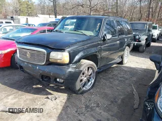 1999 Cadillac Escalade z VIN 1GYEK13R4XR411823, wystawiony jako IAAI lot #41221246 z przebiegiem 184 123 mil mil oraz . Historia ofert i sprzedaży dostępna na DreamBid. Obrazek 2.