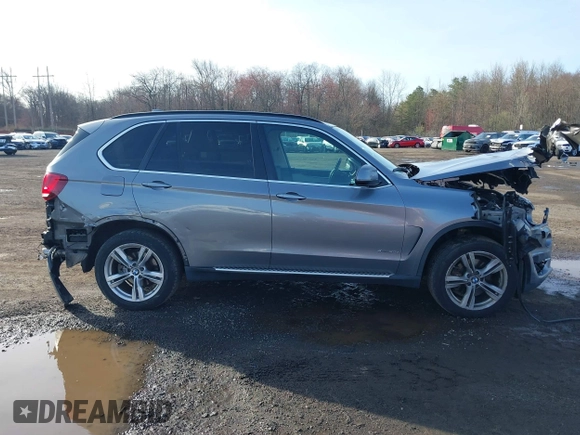 2014 BMW X5 xDrive35i z VIN 5UXKR0C52E0H19670, wystawiony jako IAAI lot #41909590 z przebiegiem 137 758 mil mil oraz . Historia ofert i sprzedaży dostępna na DreamBid. Obrazek 13.