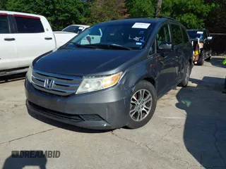 2011 Honda Odyssey EX-L with VIN 5FNRL5H6XBB073482, listed as a IAAI auction lot 42090463 with 213,061 mi miles and . Bid and sale history available at carsss.com. Image 17.