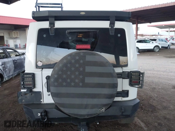 2014 Jeep Wrangler Unlimited Sahara with VIN 1C4BJWEG7EL204489, listed as a IAAI auction lot 41255239 with 68,803 mi miles and . Bid and sale history available at DreamBid. Image 16.