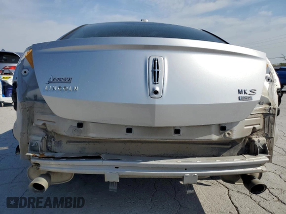 2013 Lincoln MKS with VIN 1LNHL9EK0DG612314, listed as a Copart auction lot 52901685 with 124,828 mi miles and Salvage title. Bid and sale history available at DreamBid. Image 6.