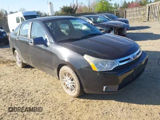 2009 Ford Focus SE with VIN 1FAHP35N29W246035, listed as a IAAI auction lot 42041059 with 146,416 mi miles. Bid and sale history available at carsss.com. Image 1.