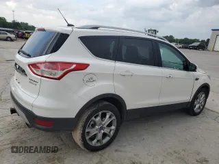 2014 Ford Escape Titanium с VIN 1FMCU0J97EUB15513, выставлен на аукционе Copart как лот 57391715 с пробегом 125 851 миль миль и Списание • Salvage title. История ставок и продаж доступна на DreamBid. Изображение 3.