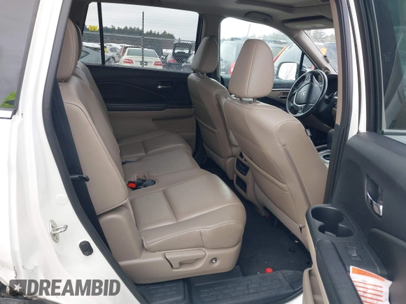 2017 Honda Pilot EX-L with VIN 5FNYF6H52HB015651, listed as a IAAI auction lot 41538814 with 121,433 mi miles and . Bid and sale history available at DreamBid. Image 8.