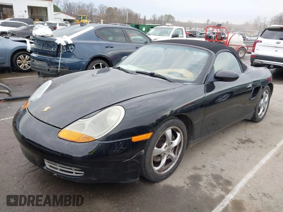2002 Porsche Boxster z VIN WP0CA298X2U623474, wystawiony jako IAAI lot #41754154 z przebiegiem 98 896 mil mil oraz . Historia ofert i sprzedaży dostępna na DreamBid. Obrazek 2.