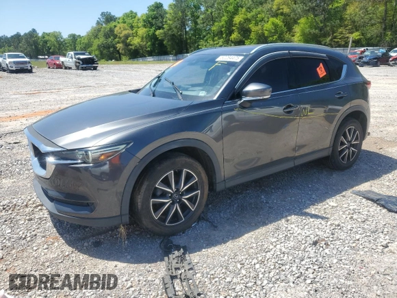 2018 Mazda CX-5 Grand Touring with VIN JM3KFADM9J0343621, listed as a Copart auction lot 52284475 with 129,776 mi miles and Salvage Title. Bid and sale history available at DreamBid. Image 1.