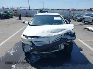 2013 Toyota Corolla L with VIN JTDBU4EE1DJ116557, listed as a IAAI auction lot 41981691 with 169,898 mi miles. Bid and sale history available at carsss.com. Image 6.