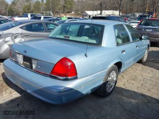 2005 Ford Crown Victoria LX with VIN 2FAFP74W65X135964, listed as a IAAI auction lot 41271175 with 82,494 mi miles. Bid and sale history available at carsss.com. Image 4.