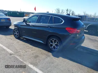 2018 BMW X1 xDrive28i with VIN WBXHT3C36J5F91110, listed as a IAAI auction lot 41757293 with 80,327 mi miles. Bid and sale history available at carsss.com. Image 3.