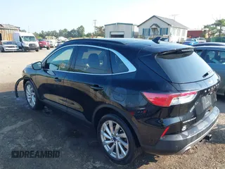 2021 Ford Escape Titanium Hybrid with VIN 1FMCU9DZ0MUB14833, listed as a IAAI auction lot 42593983 with 51,852 mi miles and . Bid and sale history available at DreamBid. Image 3.