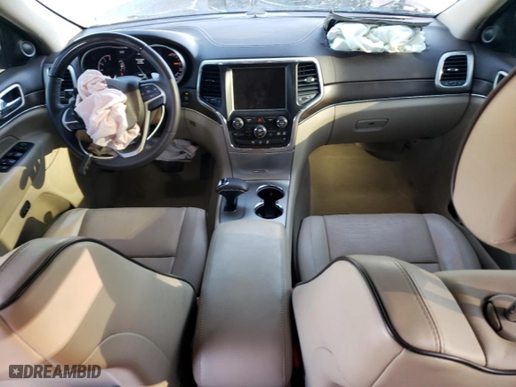 2014 Jeep Grand Cherokee Overland with VIN 1C4RJFCM2EC556953, listed as a Copart auction lot 73046974 with 106,889 mi miles and Salvage Title. Bid and sale history available at carsss.com. Image 8.