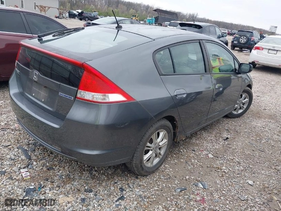 2010 Honda Insight EX with VIN JHMZE2H7XAS024879, listed as a IAAI auction lot 42029553 with 187,648 mi miles. Bid and sale history available at carsss.com. Image 4.