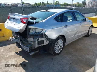2015 Ford Fusion SE Hybrid with VIN 3FA6P0LUXFR296373, listed as a IAAI auction lot 42600980 with 76,985 mi miles and . Bid and sale history available at DreamBid. Image 4.