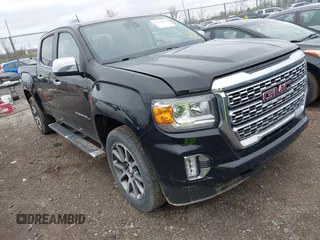 2021 GMC Canyon 4WD Denali with VIN 1GTG6EEN6M1260580, listed as a IAAI auction lot 41918693 with 52,085 mi miles. Bid and sale history available at carsss.com. Image 1.