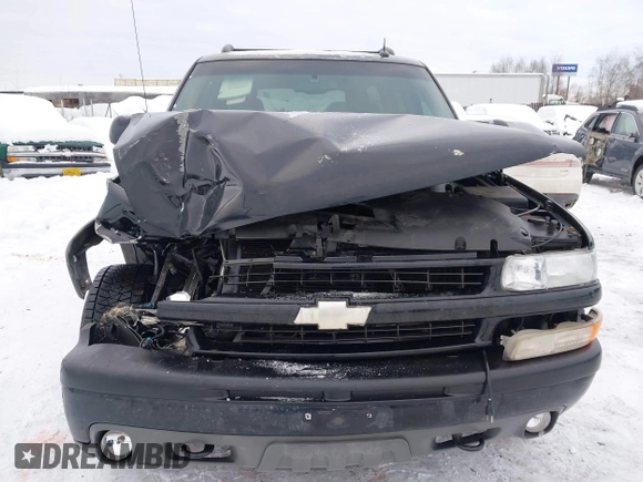 2005 Chevrolet Suburban Z71 with VIN 3GNFK16ZX5G284585, listed as a IAAI auction lot 41588062 with 212,848 mi miles. Bid and sale history available at carsss.com. Image 12.