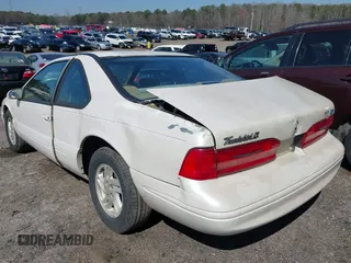 1996 Ford Thunderbird LX with VIN 1FALP62W8TH128351, listed as a IAAI auction lot 41730676 with 166,550 mi miles. Bid and sale history available at carsss.com. Image 3.