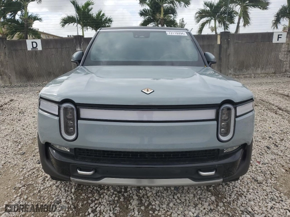2024 Rivian R1S Adventure with VIN 7PDSGABA1RN031380, listed as a Copart auction lot 73119354 with 6,786 mi miles and Salvage Title. Bid and sale history available at carsss.com. Image 5.