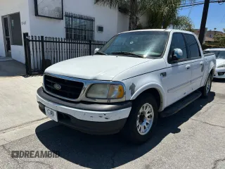 2001 Ford F-150 XLT с VIN 1FTRW07L11KF90642, выставлен на аукционе Copart как лот 64489205 с пробегом 242 959 миль миль и Списание • Salvage title. История ставок и продаж доступна на DreamBid. Изображение 2.