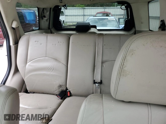 2009 Mercury Mariner Premier with VIN 4M2CU87GX9KJ20726, listed as a Copart auction lot 58690305 with 174,698 mi miles and Salvage title. Bid and sale history available at DreamBid. Image 10.