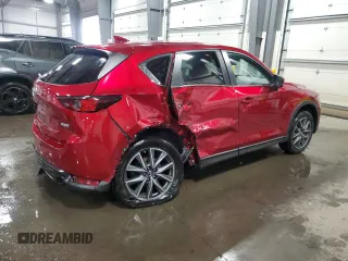 2018 Mazda CX-5 Touring z VIN JM3KFBCM5J0462676, wystawiony jako Copart lot #57892015 z przebiegiem 76 566 mil mil oraz Szkoda całkowita • Salvage title. Historia ofert i sprzedaży dostępna na DreamBid. Obrazek 3.