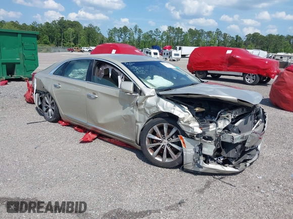 2014 Cadillac XTS z VIN 2G61L5S39E9159583, wystawiony jako IAAI lot #36024597 z przebiegiem 118 461 mil mil oraz . Historia ofert i sprzedaży dostępna na DreamBid. Obrazek 1.