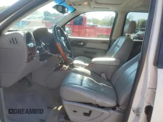 2007 GMC Envoy Denali with VIN 1GKES63M172227637, listed as a Copart auction lot 49858135 with 198,736 mi miles and Salvage Title. Bid and sale history available at carsss.com. Image 7.