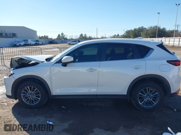 2019 Mazda CX-5 Touring with VIN JM3KFACM4K1668352, listed as a IAAI auction lot 41481291 with 65,901 mi miles and . Bid and sale history available at carsss.com. Image 14.