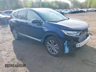 2021 Honda CR-V Touring z VIN 7FART6H92ME029029, wystawiony jako IAAI lot #42119409 z przebiegiem 18 336 mil mil oraz . Historia ofert i sprzedaży dostępna na DreamBid. Obrazek 1.