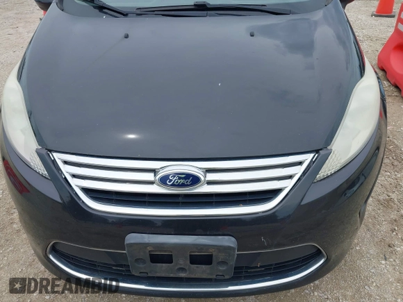 2011 Ford Fiesta SE z VIN 3FADP4BJ3BM147784, wystawiony jako IAAI lot #42567083 z przebiegiem 104 843 mil mil oraz . Historia ofert i sprzedaży dostępna na DreamBid. Obrazek 6.