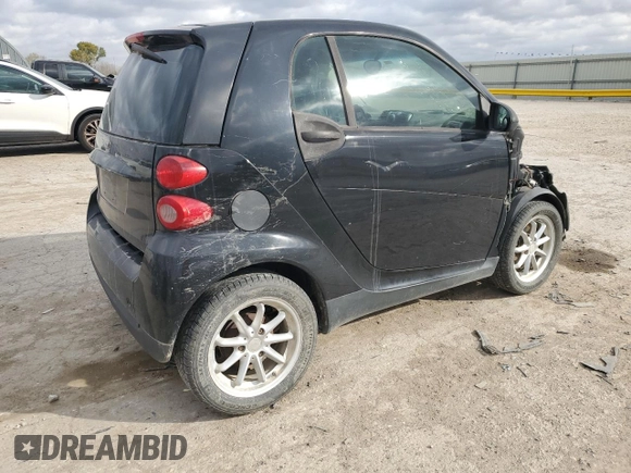 2009 Smart fortwo Pure with VIN WMEEJ31X19K267800, listed as a Copart auction lot 77392744 with 100,178 mi miles and Salvage Title. Bid and sale history available at carsss.com. Image 3.