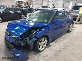 2014 Hyundai Veloster with VIN KMHTC6AD4EU196870, listed as a IAAI auction lot 41207663 with 119,252 mi miles. Bid and sale history available at carsss.com. Image 2.