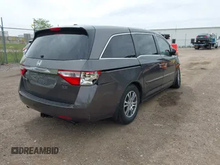 2011 Honda Odyssey EX-L with VIN 5FNRL5H68BB100274, listed as a IAAI auction lot 42159787 with 205,616 mi miles and . Bid and sale history available at carsss.com. Image 4.