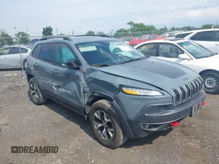 2014 Jeep Cherokee Trailhawk with VIN 1C4PJMBS9EW161548, listed as a IAAI auction lot 42471865 with 156,530 mi miles and . Bid and sale history available at DreamBid. Image 1.