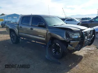 2014 Toyota Tacoma with VIN 3TMLU4EN3EM143882, listed as a IAAI auction lot 40657975 with 125,008 mi miles. Bid and sale history available at carsss.com. Image 1.