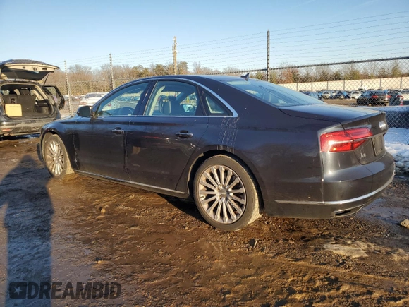 2015 Audi A8 z VIN WAUJGAFD4FN028750, wystawiony jako Copart lot #89099265 z przebiegiem 44 149 mil mil oraz Szkoda całkowita • Salvage title. Historia ofert i sprzedaży dostępna na DreamBid. Obrazek 2.