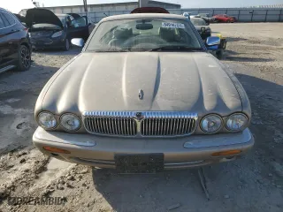 1999 Jaguar XJ with VIN SAJKX6040XC857312, listed as a Copart auction lot 84918704 with 75,425 mi miles and Clean Title. Bid and sale history available at carsss.com. Image 5.