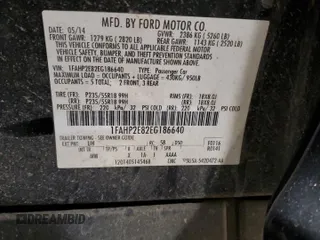 2014 Ford Taurus SEL z VIN 1FAHP2E82EG186640, wystawiony jako Copart lot #55820205 z przebiegiem 194 843 mil mil oraz Czysty tytuł • Clean title. Historia ofert i sprzedaży dostępna na DreamBid. Obrazek 12.