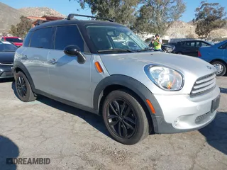 2013 MINI Cooper Countryman with VIN WMWZB3C59DWM09740, listed as a IAAI auction lot 41648192 with 145,915 mi miles. Bid and sale history available at carsss.com. Image 1.