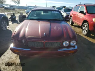 1999 Jaguar XJ with VIN SAJPX1849XC857869, listed as a Copart auction lot 83773914 with 172,496 mi miles and Clean title. Bid and sale history available at DreamBid. Image 5.