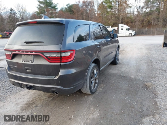 2015 Dodge Durango SXT with VIN 1C4RDJAG4FC784865, listed as a IAAI auction lot 40872452 with 145,877 mi miles and . Bid and sale history available at carsss.com. Image 4.