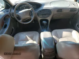 1999 Mercury Sable LS z VIN 1MEFM53S7XG602788, wystawiony jako Copart lot #76894294 z przebiegiem 186 315 mil mil oraz Szkody całkowita. Historia ofert i sprzedaży dostępna na DreamBid. Obrazek 8.