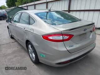 2015 Ford Fusion Energi Titanium with VIN 3FA6P0SU3FR114739, listed as a IAAI auction lot 42003011 with 120,553 mi miles. Bid and sale history available at carsss.com. Image 3.