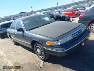 1996 Ford Crown Victoria with VIN 2FALP73W1TX206134, listed as a IAAI auction lot 41667179 with 180,230 mi miles. Bid and sale history available at carsss.com. Image 1.