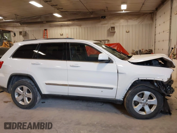 2011 Jeep Grand Cherokee 70th Anniversary with VIN 1J4RR4GG4BC702759, listed as a IAAI auction lot 41871604 with 143,583 mi miles. Bid and sale history available at carsss.com. Image 13.