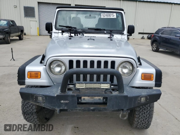2005 Jeep Wrangler X with VIN 1J4FA39S55P353789, listed as a Copart auction lot 62469015 with 143,817 mi miles and Salvage title. Bid and sale history available at DreamBid. Image 5.